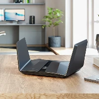 NETGEAR Nighthawk RAXE500 - Router wireless - switch a 4 porte - GigE, 2.5 GigE - 802.11a/b/g/n/ac/ax - multibanda